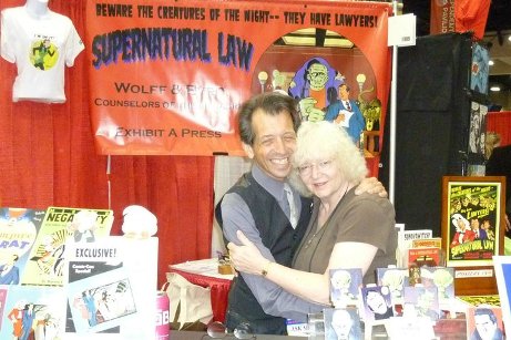 Jackie Estrada with husband, Batton Lash, at their Exhibit A Press booth.